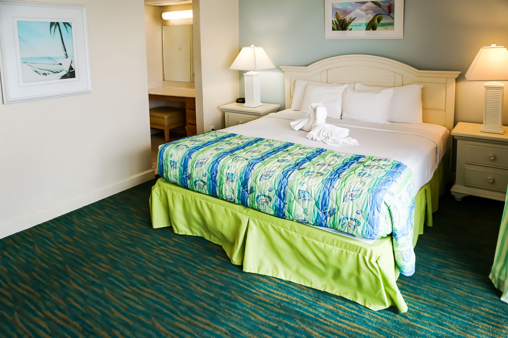 A vibrant master bedroom at VRI's Landmark Holiday Beach Resort in Panama City, Florida.
